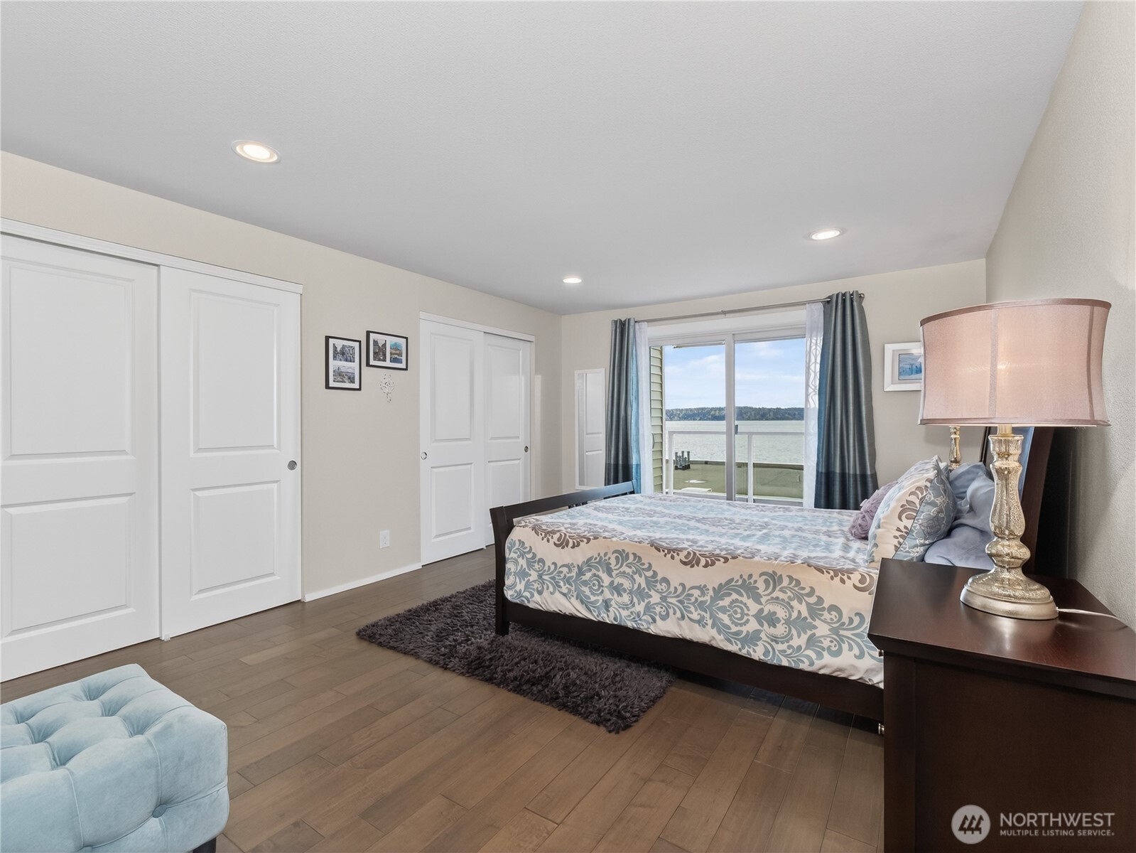 10203 47th Avenue Southwest, Unit C8 Seattle, WA 98146 - Photo 11 of 39 a bedroom with a bed and a window