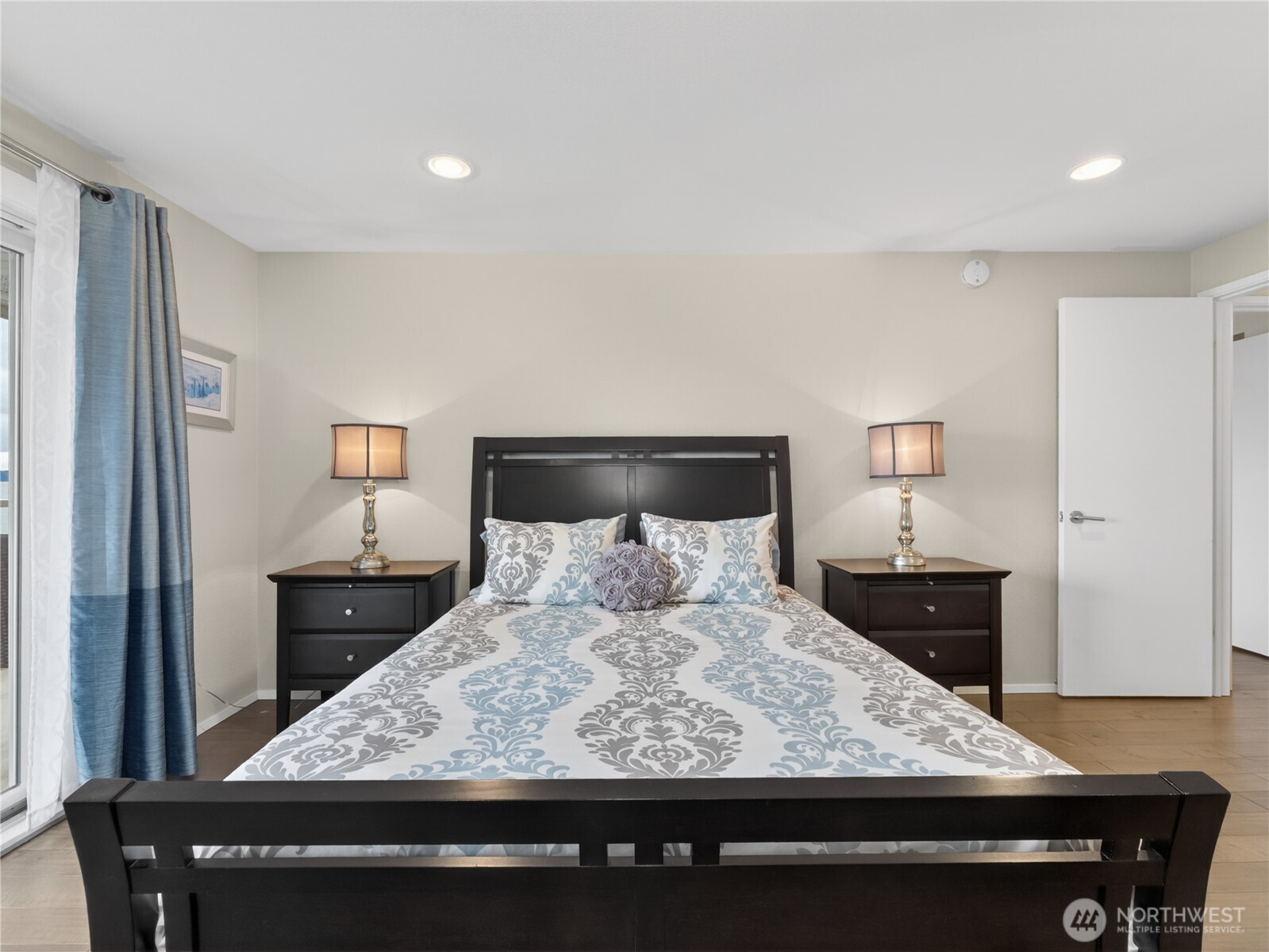 10203 47th Avenue Southwest, Unit C8 Seattle, WA 98146 - Photo 12 of 39 a large bed sitting in a bedroom and a dresser