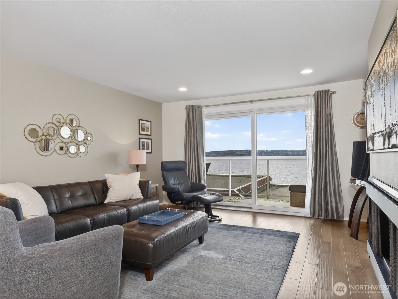 10203 47th Avenue Southwest, Unit C8 Seattle, WA 98146 - Photo 4 of 39 a living room with furniture and a floor to ceiling window