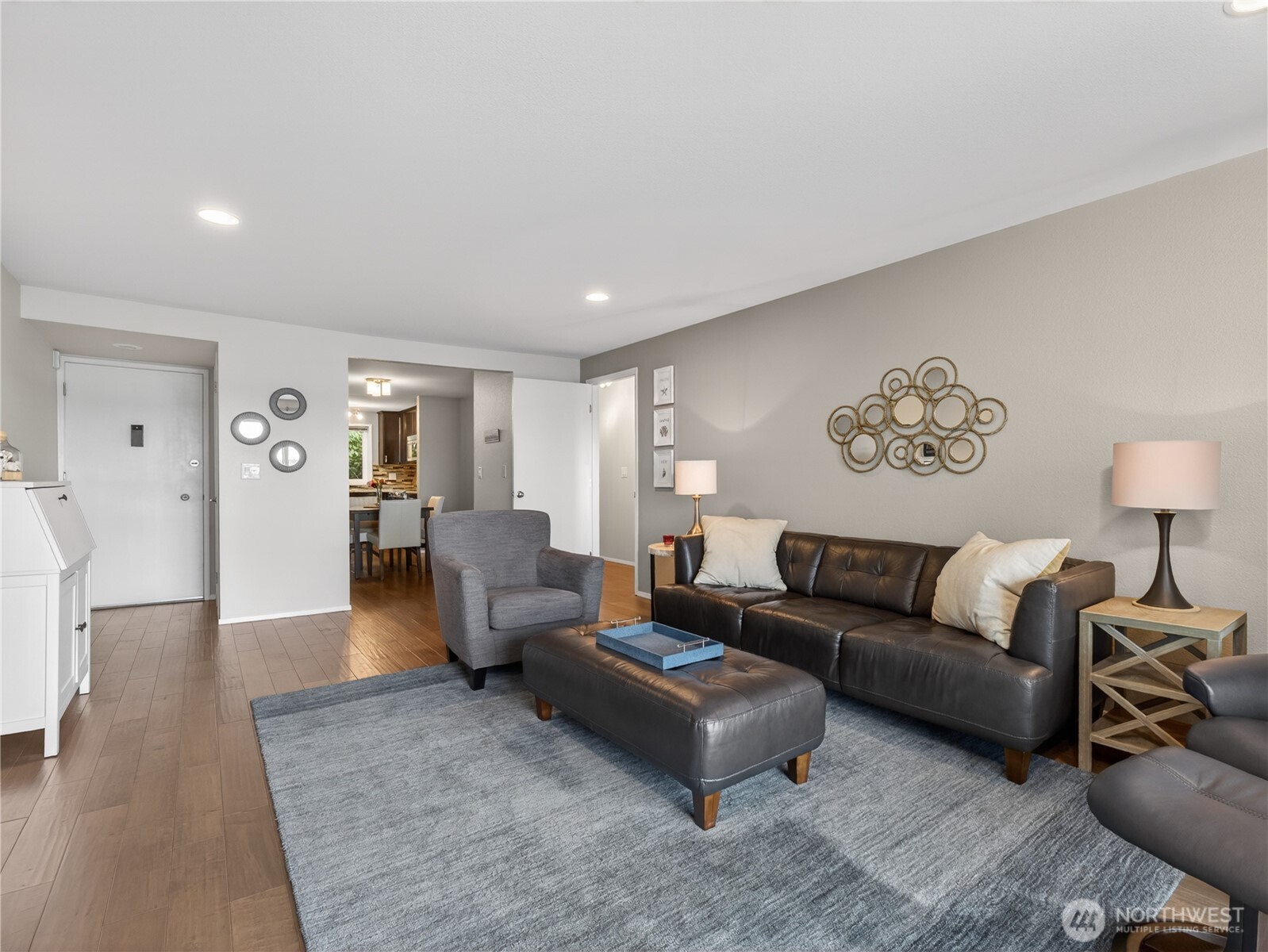 10203 47th Avenue Southwest, Unit C8 Seattle, WA 98146 - Photo 5 of 39 a living room with furniture and a lamp