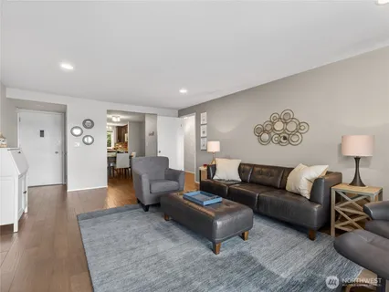 a kitchen with stainless steel appliances granite countertop a stove sink and microwave