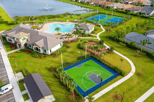 an aerial view of house with yard swimming pool and outdoor seating