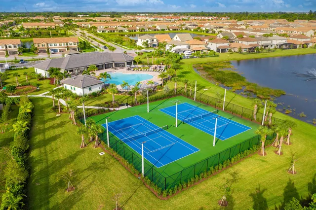 a kitchen with granite countertop a stainless steel appliances and wooden floor