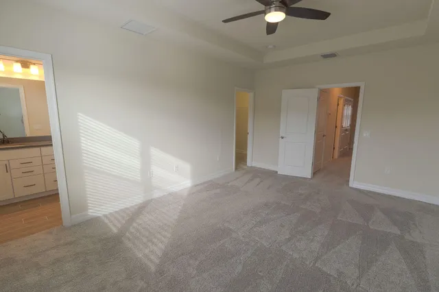a bathroom with a granite countertop sink toilet a large mirror and shower