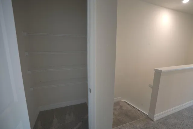 a view of a room with racks on the wall