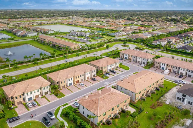 an aerial view of a house with a big yard
