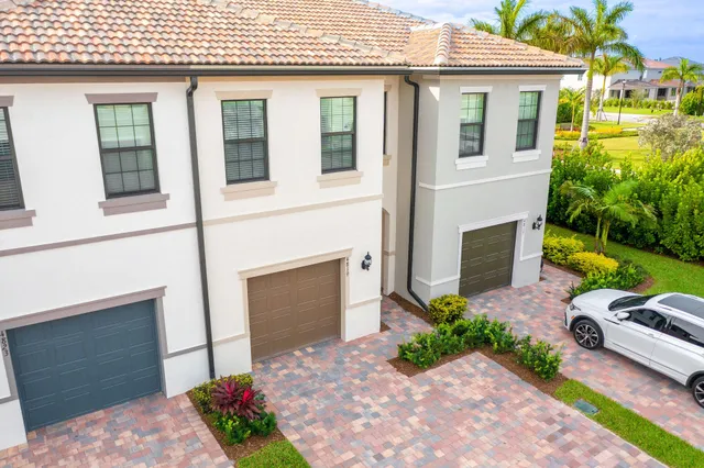 view of a pool with a table and chairs