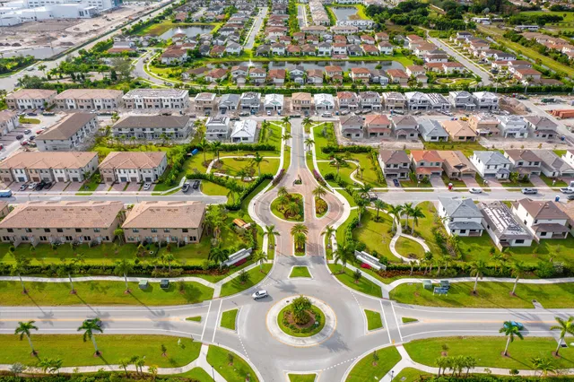 an aerial view of a house with a swimming pool yard and outdoor seating