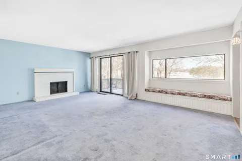 a view of an empty room with windows