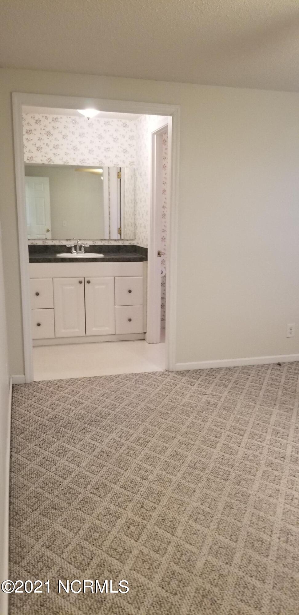 2695 Pauls Path Road Kinston, NC 28504 - Photo 23 of 40 Mast Bed and Bath - Closet to the left of vanity bathroom to the right.