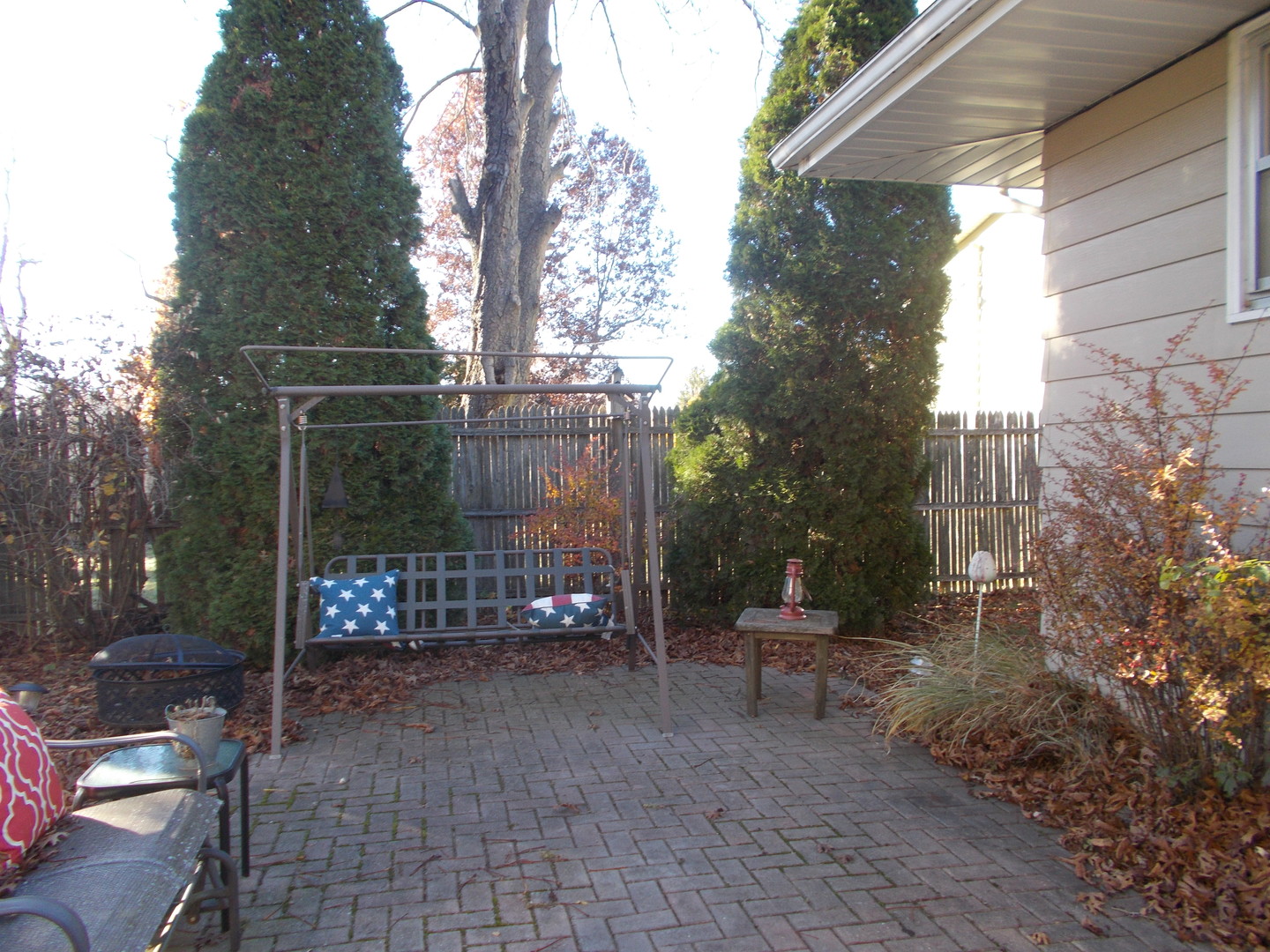 905 Winthrop Court Zion, IL 60099 - Photo 11 of 13 a view of a bench in a backyard