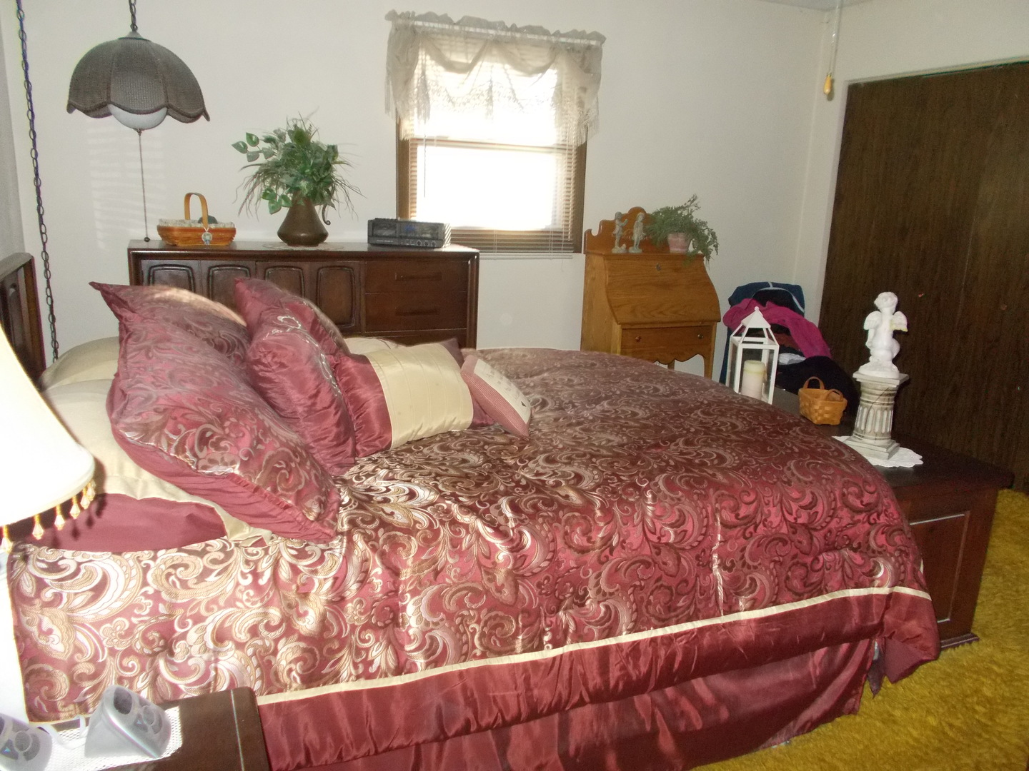 905 Winthrop Court Zion, IL 60099 - Photo 4 of 13 a bed sitting in a bedroom next to a window