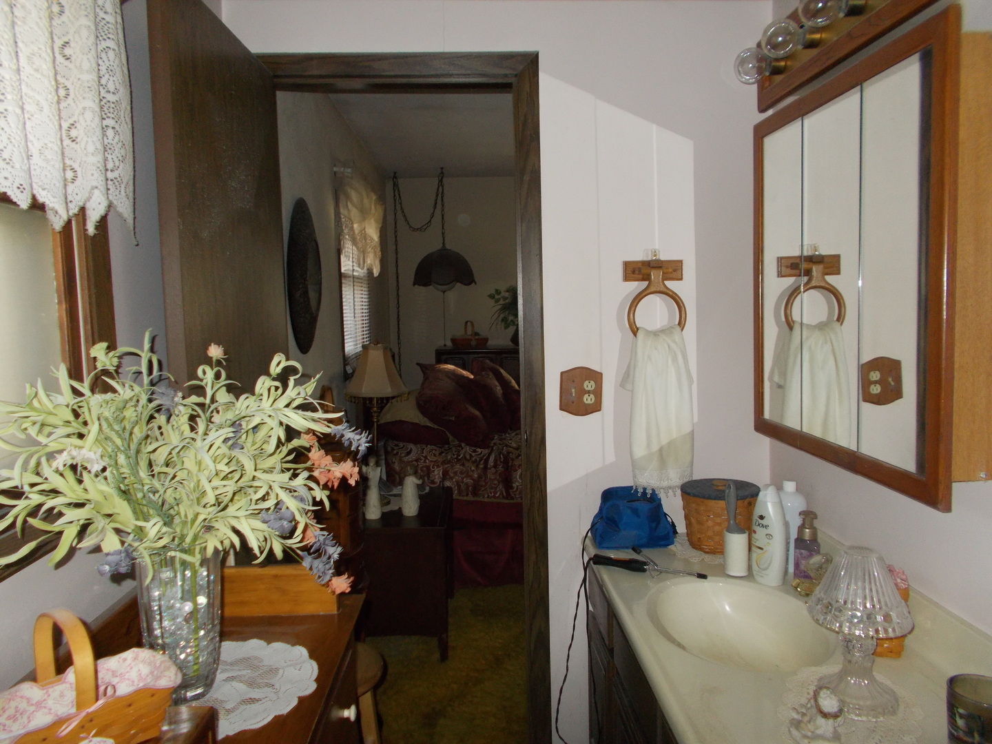 905 Winthrop Court Zion, IL 60099 - Photo 6 of 13 a bathroom with a granite countertop sink a mirror and a shower