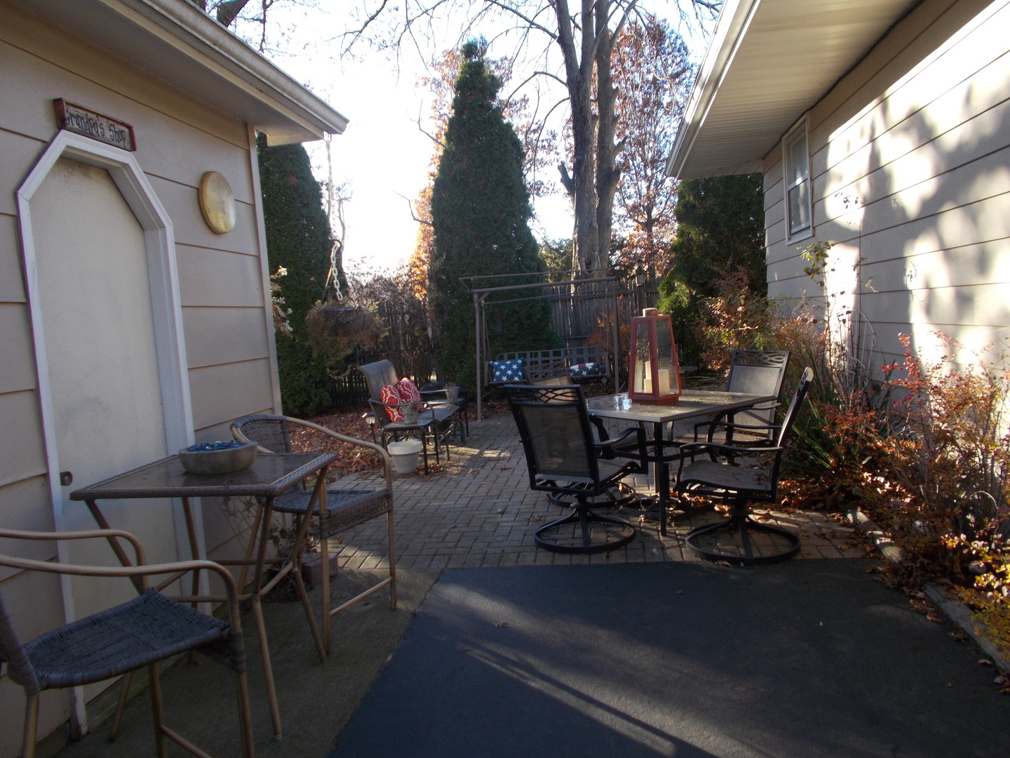 905 Winthrop Court Zion, IL 60099 - Photo 9 of 13 a view of a patio with table and chairs and potted plants