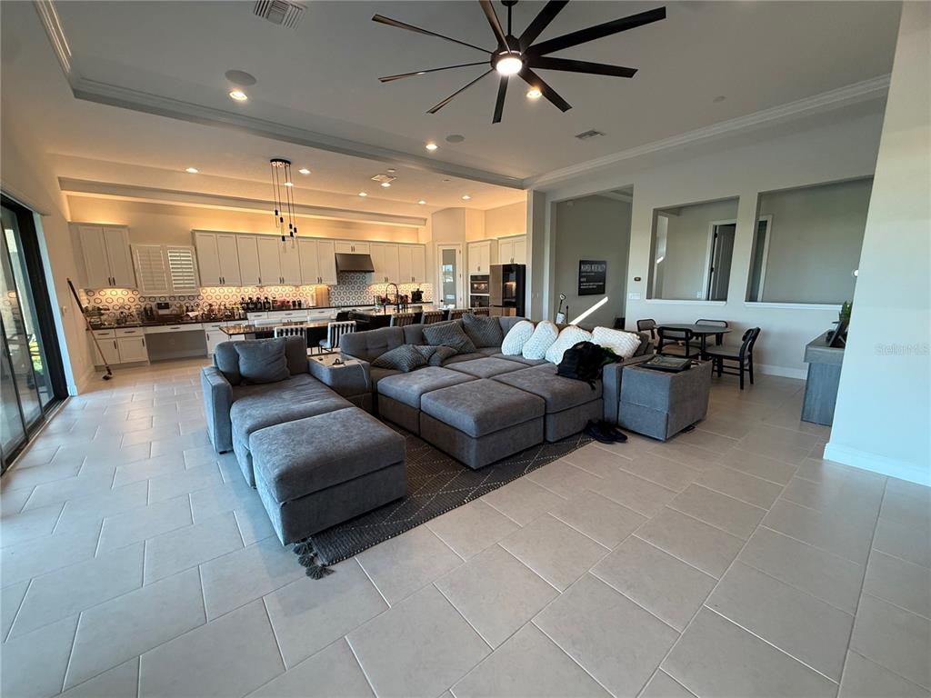 10958 Rustic Timber Loop San Antonio, FL 33576 - Photo 16 of 48 a living room with furniture and a large window