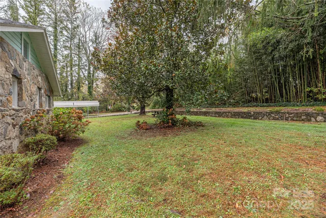 a backyard of a house with lots of green space