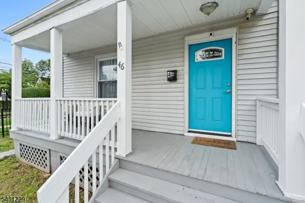 a view of porch with deck and furniture