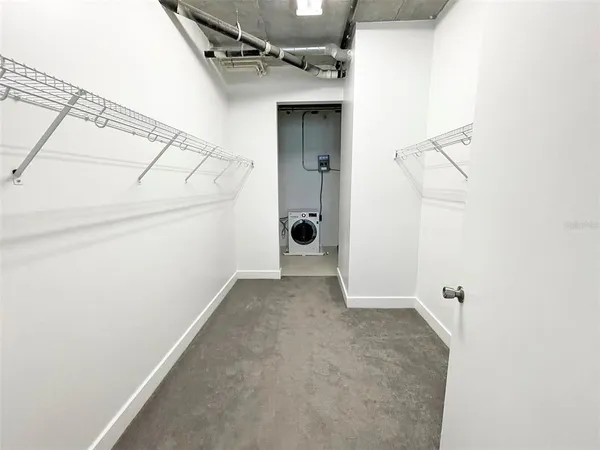 a view of a house with white walls