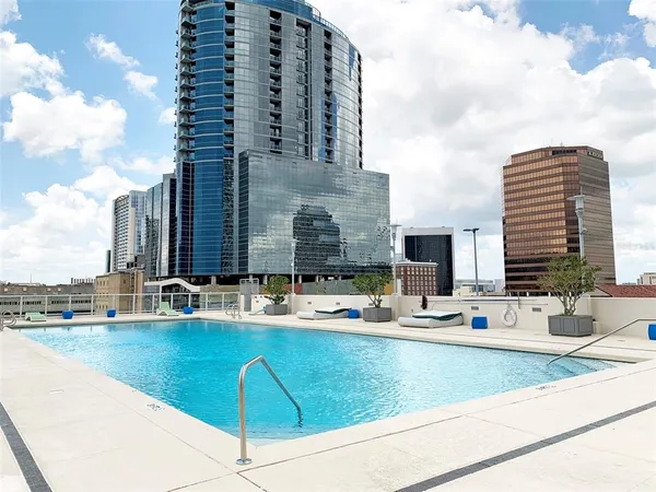 a kitchen with appliances cabinets and a table