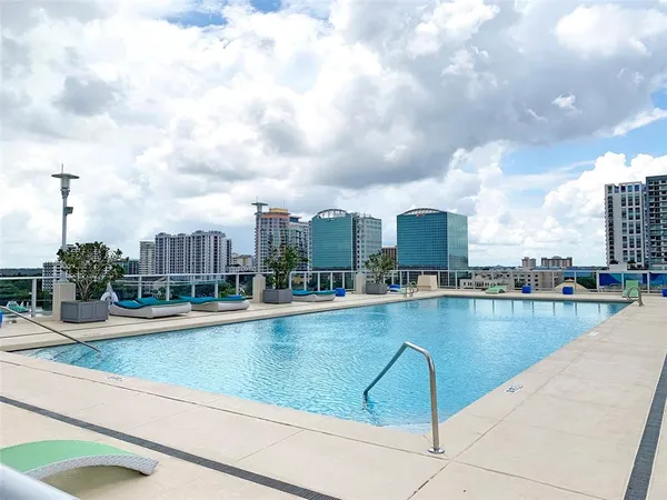 a view of a lobby with furniture and chandelier