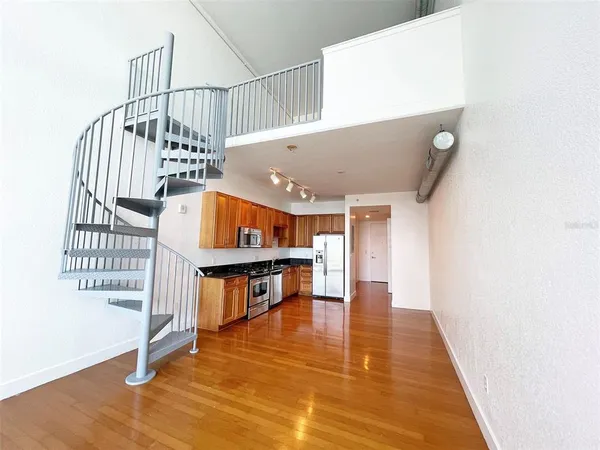a view of entryway with wooden floor