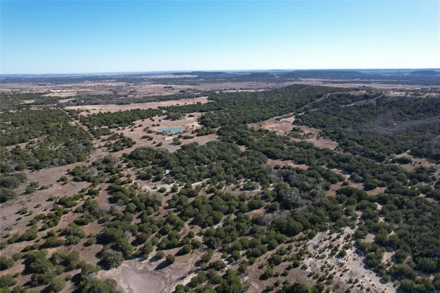 an aerial view of residential house and green space
