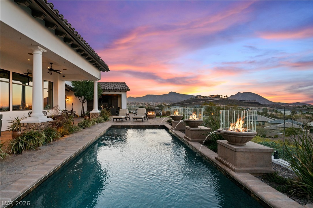 1123 Christian Road Henderson, NV 89002 - Photo 91 of 94 Bask in breathtaking sunset views from the luxurious private pool, complete with elegant fire features.