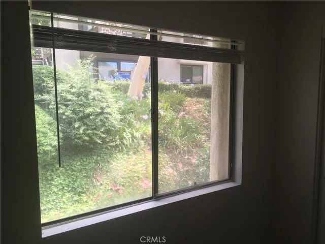 a view of a room with a large window