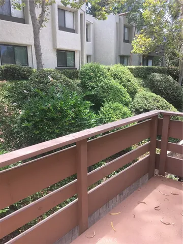 a view of balcony with two plants
