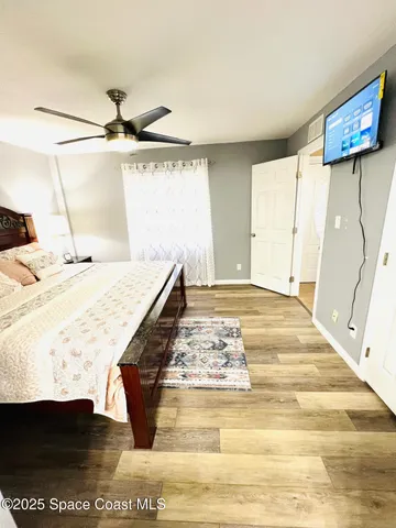 a living room with a table and a rug