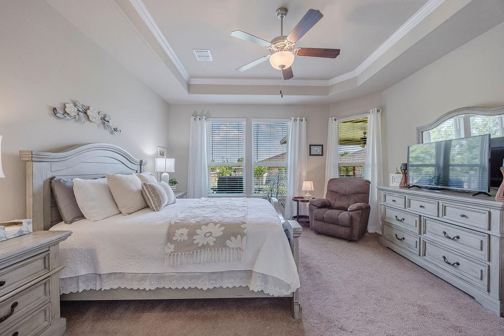 2123 Ladera Way, Unit 2123 Mansfield, TX 76063 - Photo 21 of 34 a bedroom with a large bed and a window