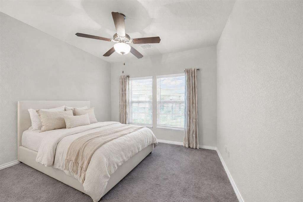 2123 Ladera Way, Unit 2123 Mansfield, TX 76063 - Photo 27 of 34 a bedroom with a bed and window