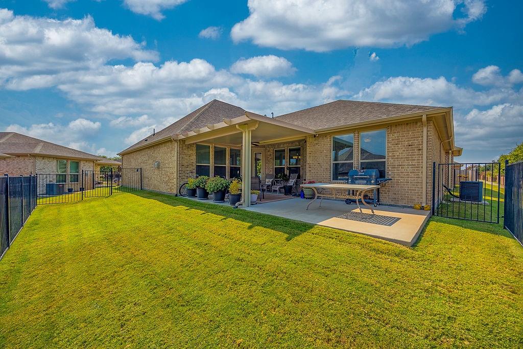 2123 Ladera Way, Unit 2123 Mansfield, TX 76063 - Photo 29 of 34 a view of a swimming pool with couches chairs and potted plants