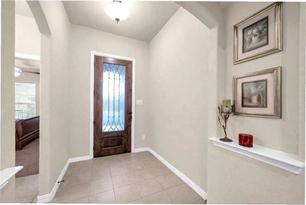 2123 Ladera Way, Unit 2123 Mansfield, TX 76063 - Photo 3 of 34 a view of a hallway to rooms