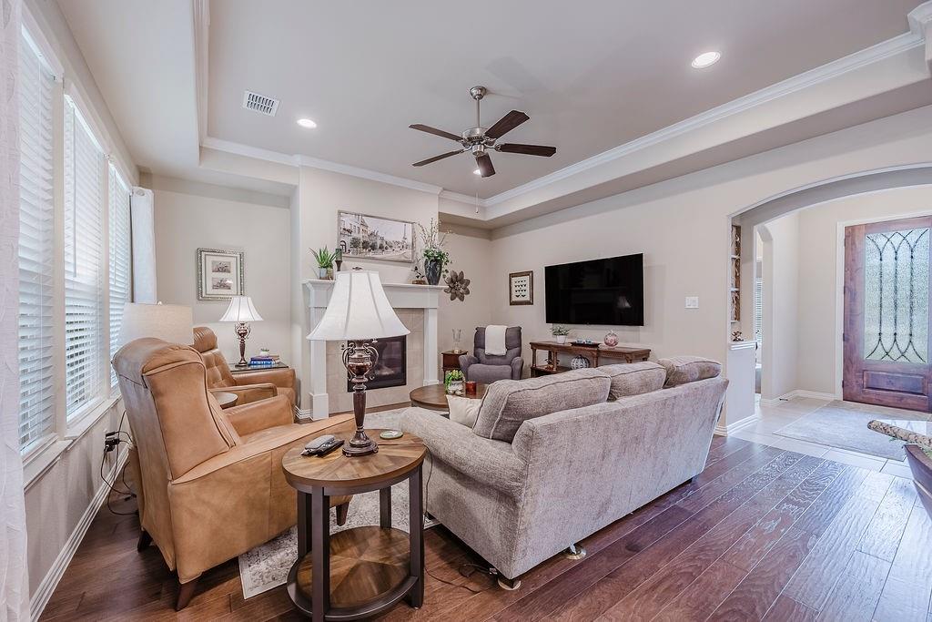 2123 Ladera Way, Unit 2123 Mansfield, TX 76063 - Photo 33 of 34 a living room with furniture and a flat screen tv