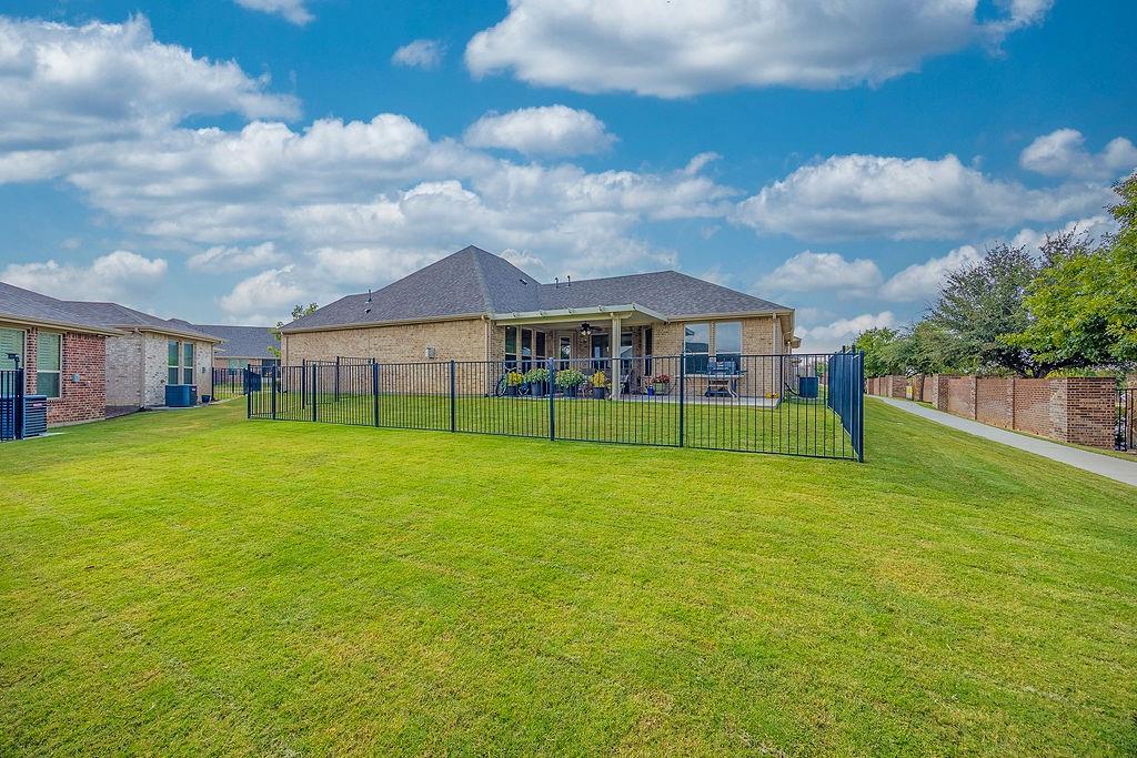 2123 Ladera Way, Unit 2123 Mansfield, TX 76063 - Photo 34 of 34 a view of an house with backyard space and balcony