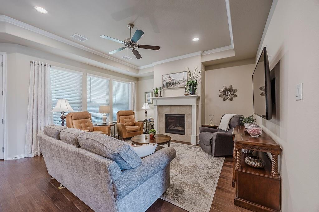 2123 Ladera Way, Unit 2123 Mansfield, TX 76063 - Photo 9 of 34 a living room with furniture and a fireplace