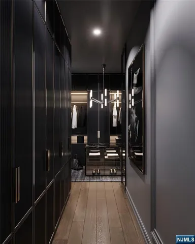 a room with kitchen island granite countertop furniture and a chandelier