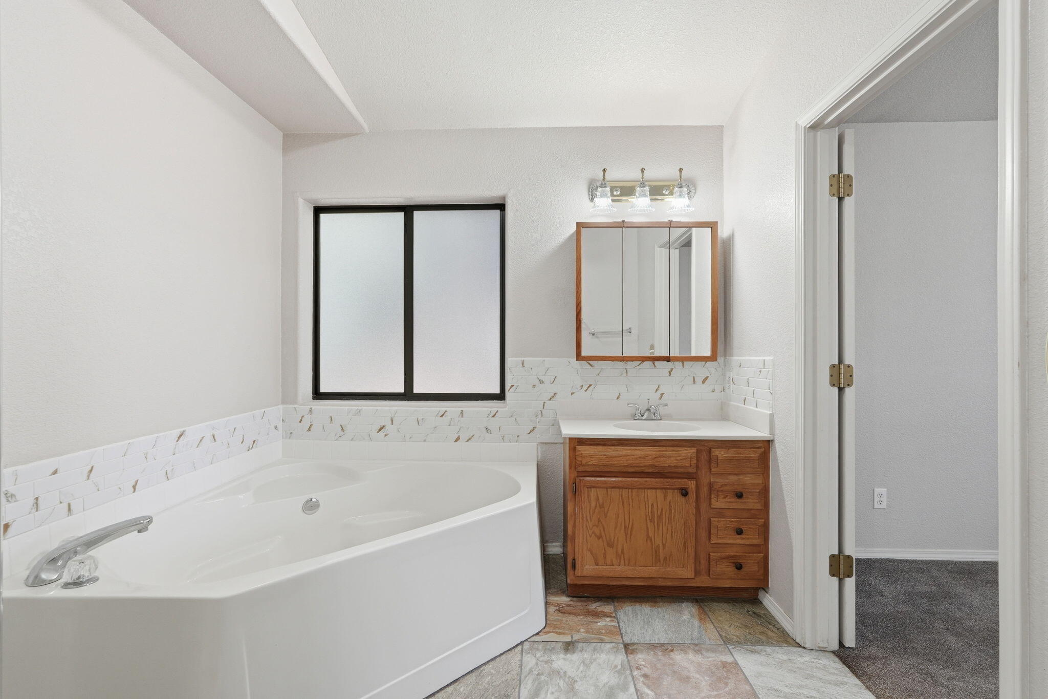 310 North Trailwood Road Payson, AZ 85541 - Photo 38 of 55 a bathroom with a bathtub and a sink