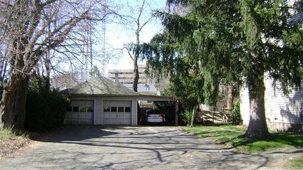 23 Riverside Street Needham, MA 02494 - Photo 2 of 12 a front view of a house with a garden