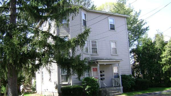 23 Riverside Street Needham, MA 02494 - Photo 4 of 12 a house that has a palm tree in front of it
