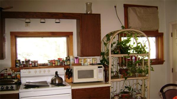 23 Riverside Street Needham, MA 02494 - Photo 9 of 12 a stove top oven sitting inside of a kitchen