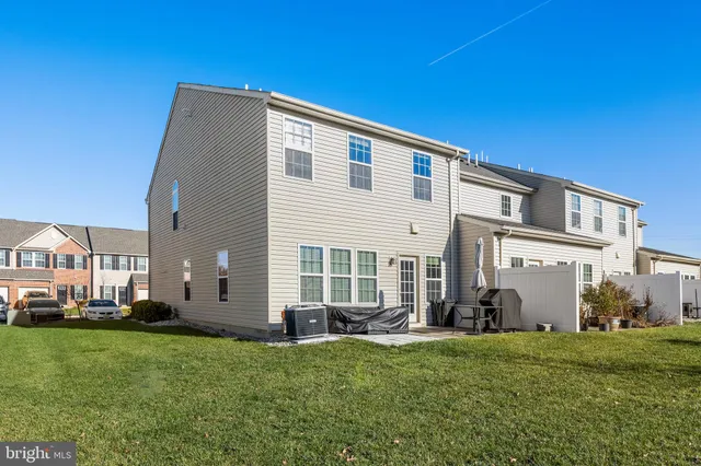 a view of yard with swimming pool and green space