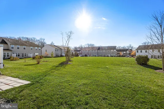 a view of a park with swings and slides