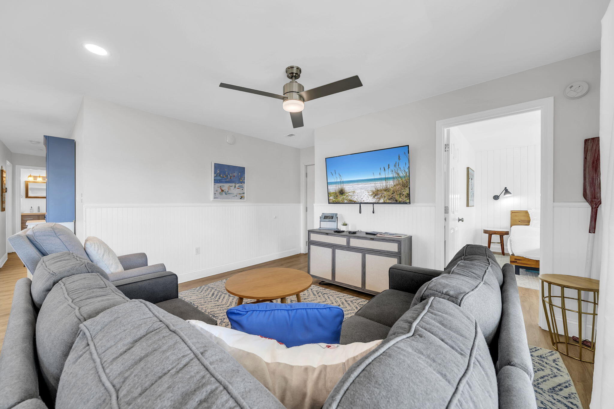 11 Beachside Drive, Unit 131 Santa Rosa Beach, FL 32459 - Photo 2 of 25 a living room with furniture a ceiling fan and a rug