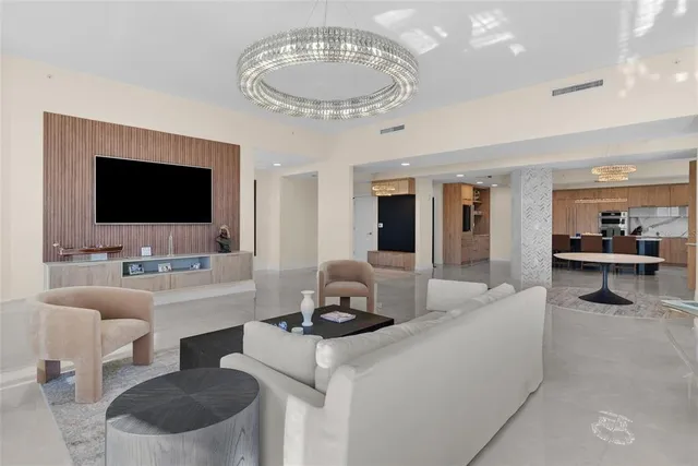 a kitchen with a table chairs sink and cabinets