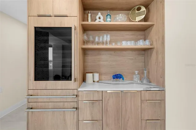 a living room with lots of furniture and a large window