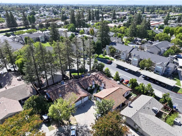 an aerial view of a city with lots of residential buildings