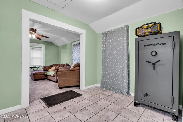 a living room with furniture and a gate