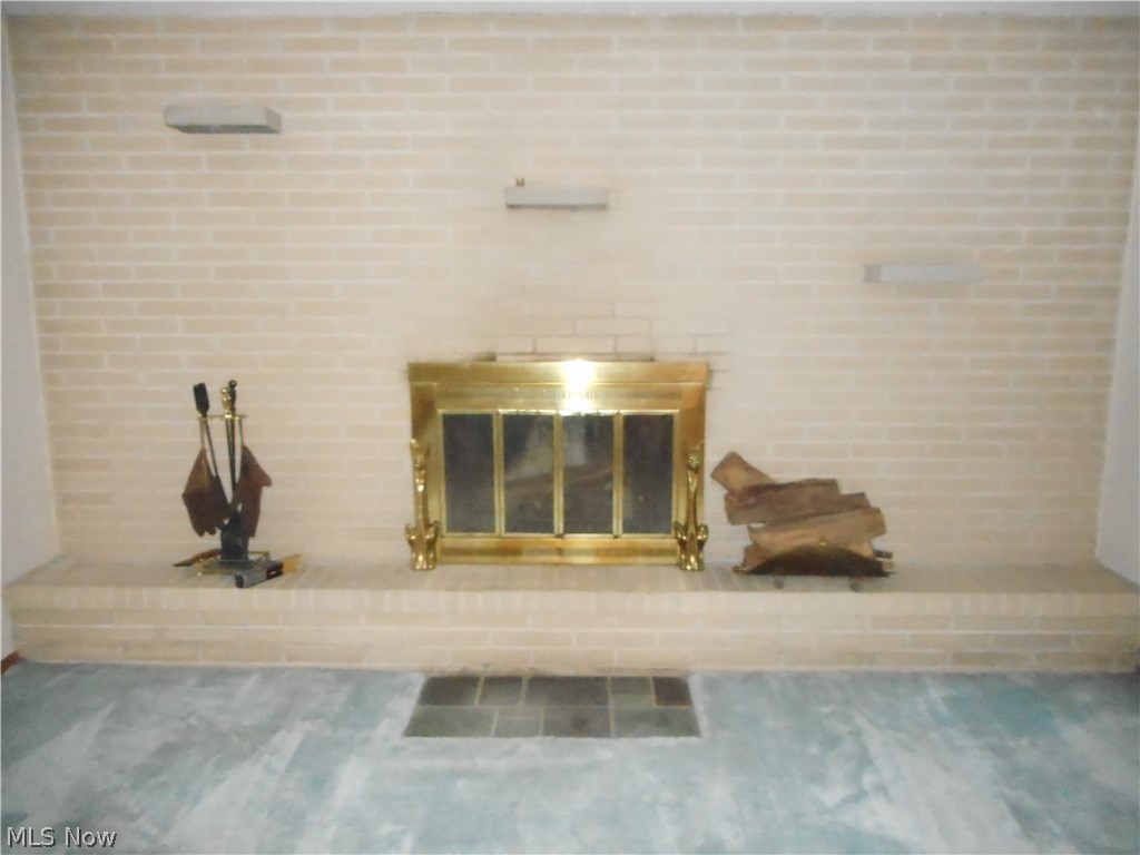 11157 County Line Road Chesterland, OH 44026 - Photo 7 of 21 Close up of the brick wood burning fireplace.